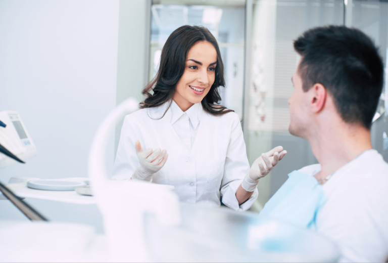 dentist-explaining-to-patient-dental-clinic-sharjah